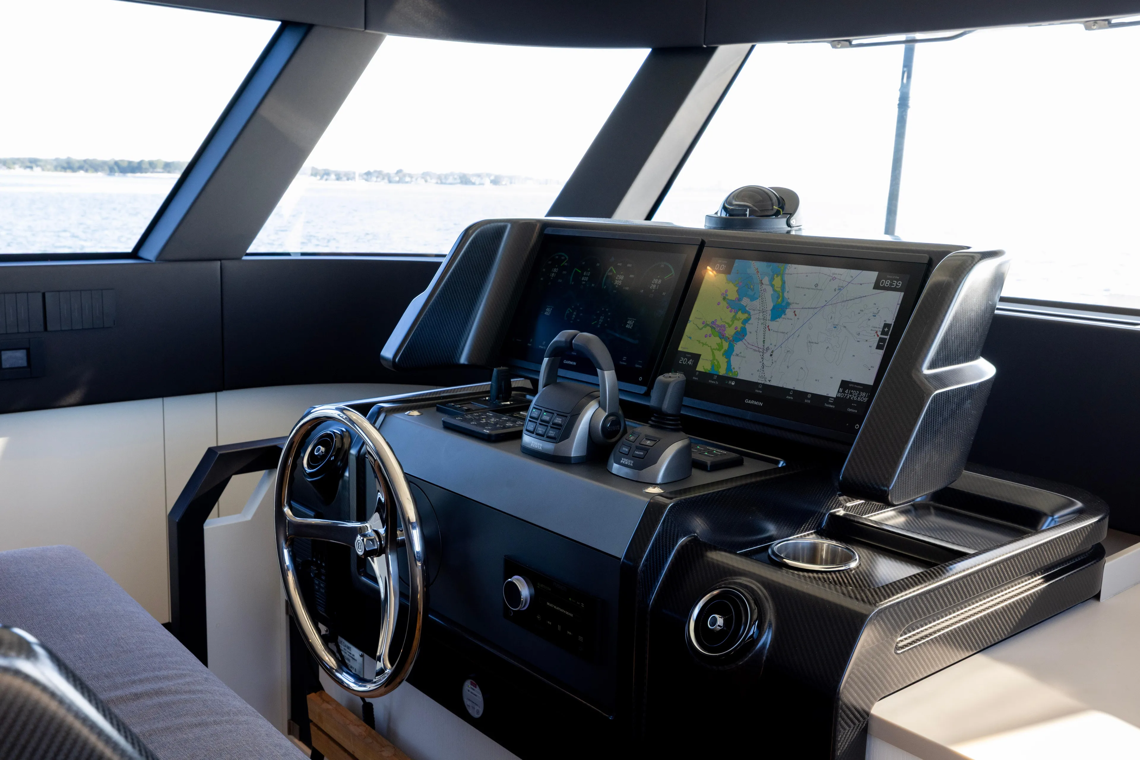 The Calm Down Yacht Photos Pics 2024 Bluegame BGX63 yacht helm with advanced navigation system and sleek design.