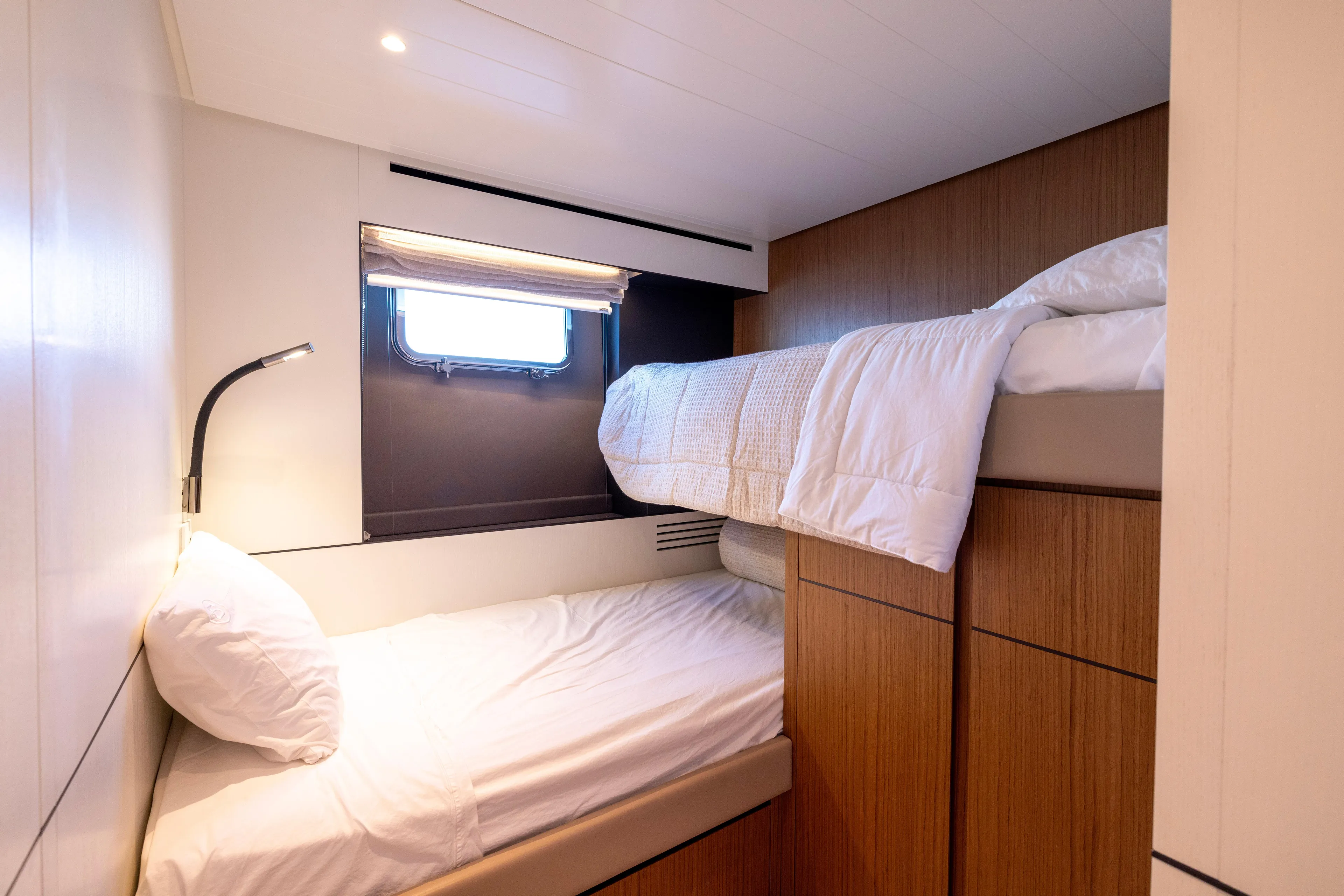 The Calm Down Yacht Photos Pics 2024 Bluegame BGX63 yacht cabin with bunk beds and modern design.