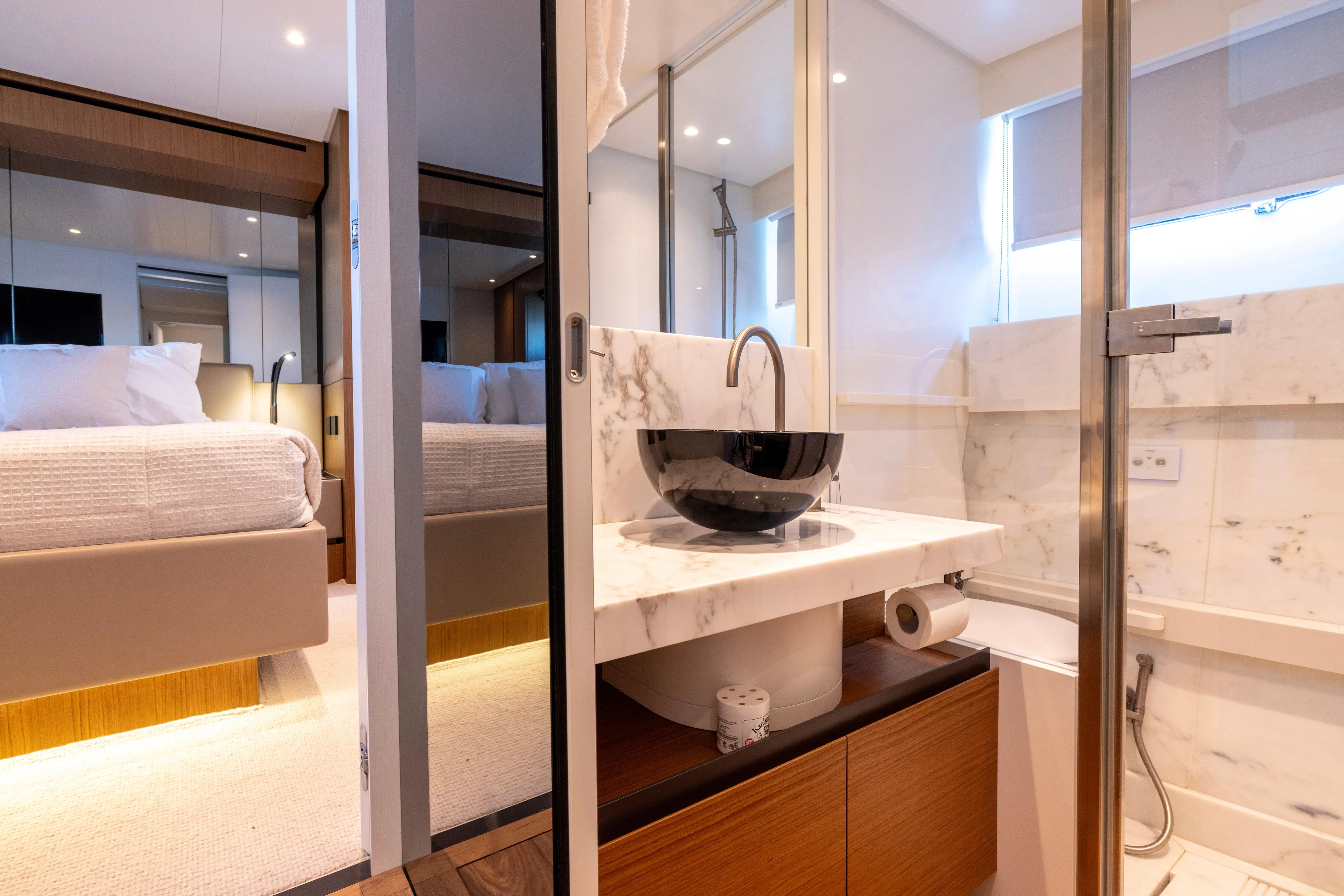The Calm Down Yacht Photos Pics Luxurious bathroom and bedroom interior of 2024 Bluegame BGX63 yacht, featuring modern design elements.