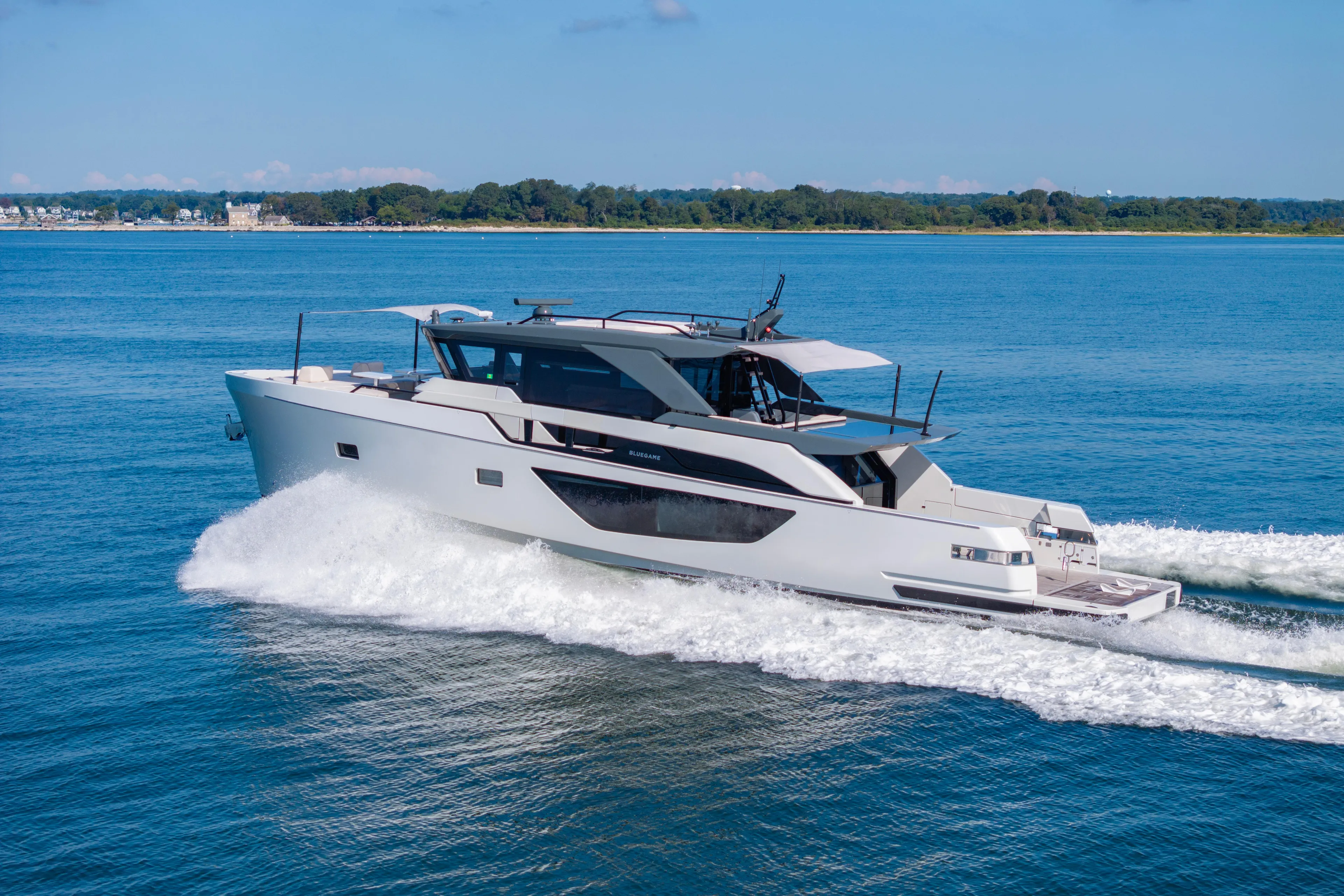 The Calm Down Yacht Photos Pics 2024 Bluegame BGX63 yacht cruising on open water, showcasing sleek design and luxury.