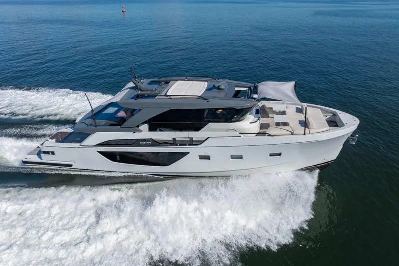 The Calm Down Yacht Photos Pics 2024 Bluegame BGX63 yacht cruising on open water, showcasing sleek design and luxury features.