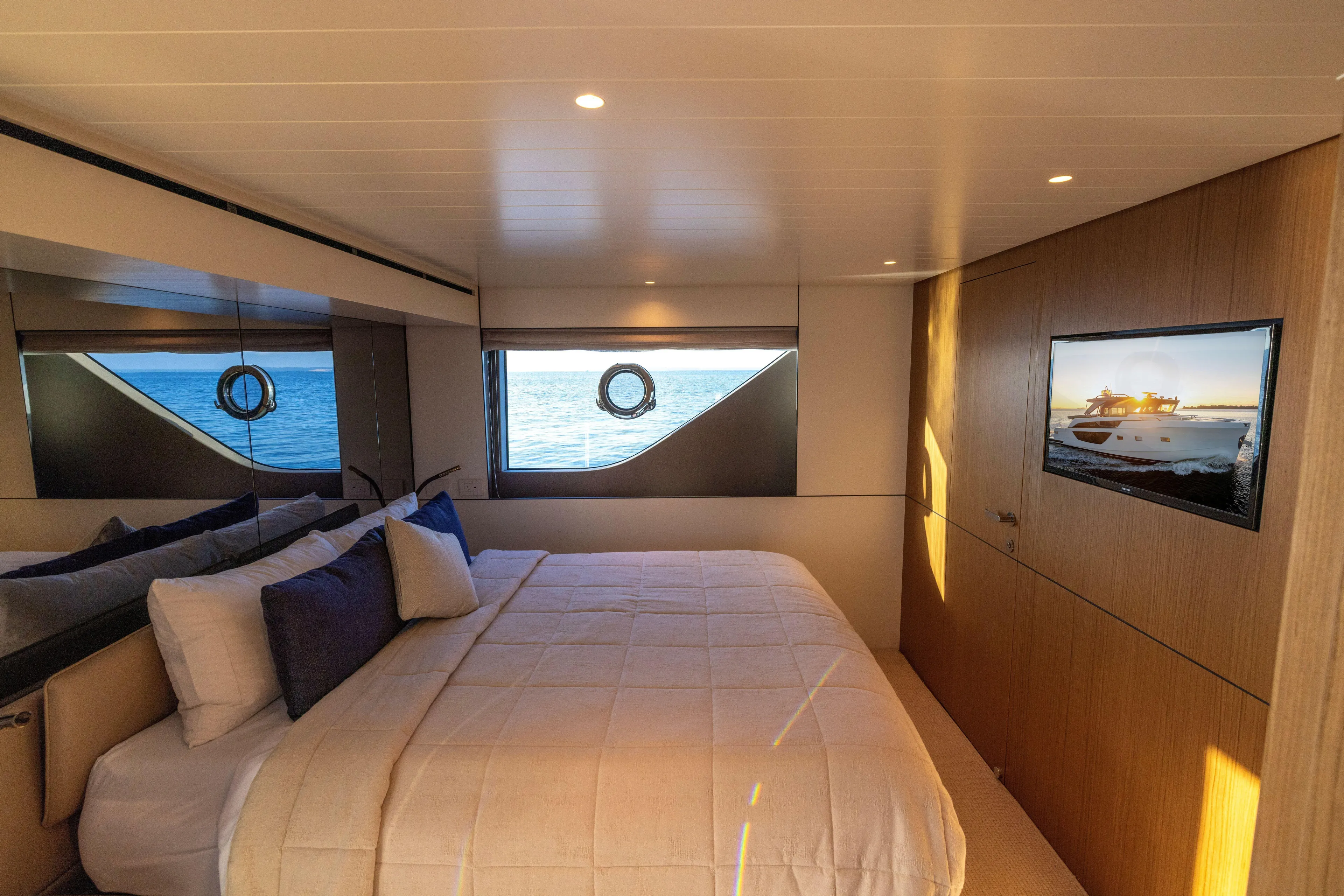 The Calm Down Yacht Photos Pics Luxurious interior cabin of 2024 Bluegame BGX63 yacht with ocean view.