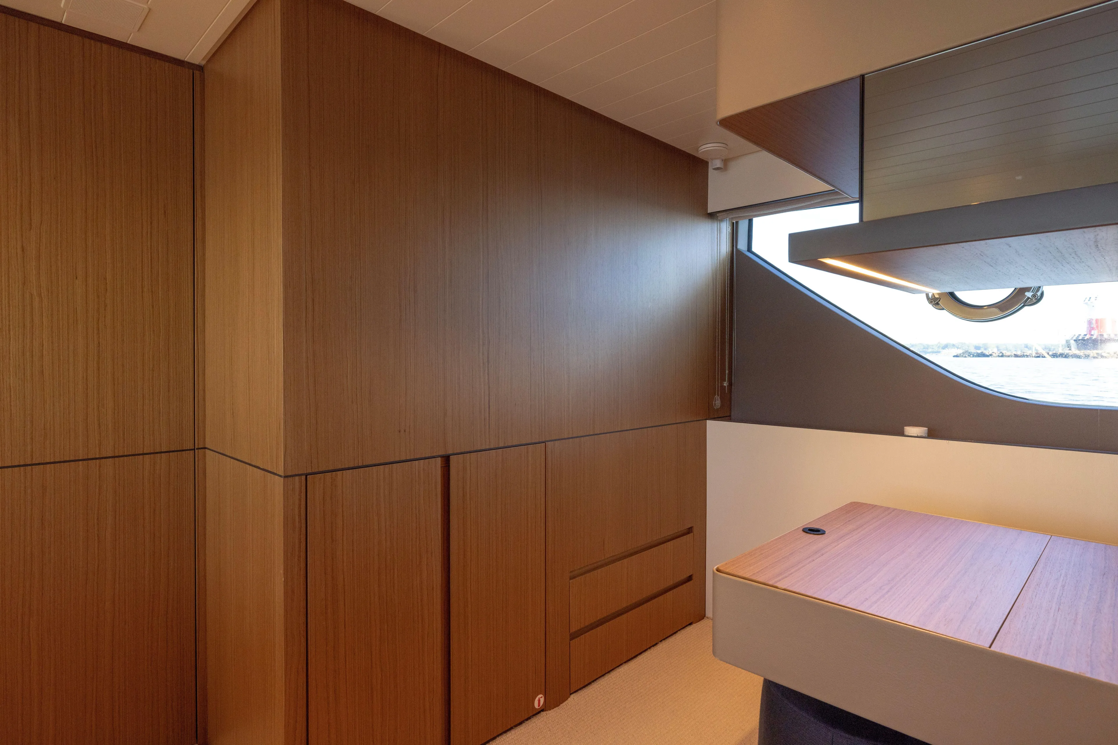 The Calm Down Yacht Photos Pics Interior of 2024 Bluegame BGX63 yacht with sleek wood paneling and modern design.