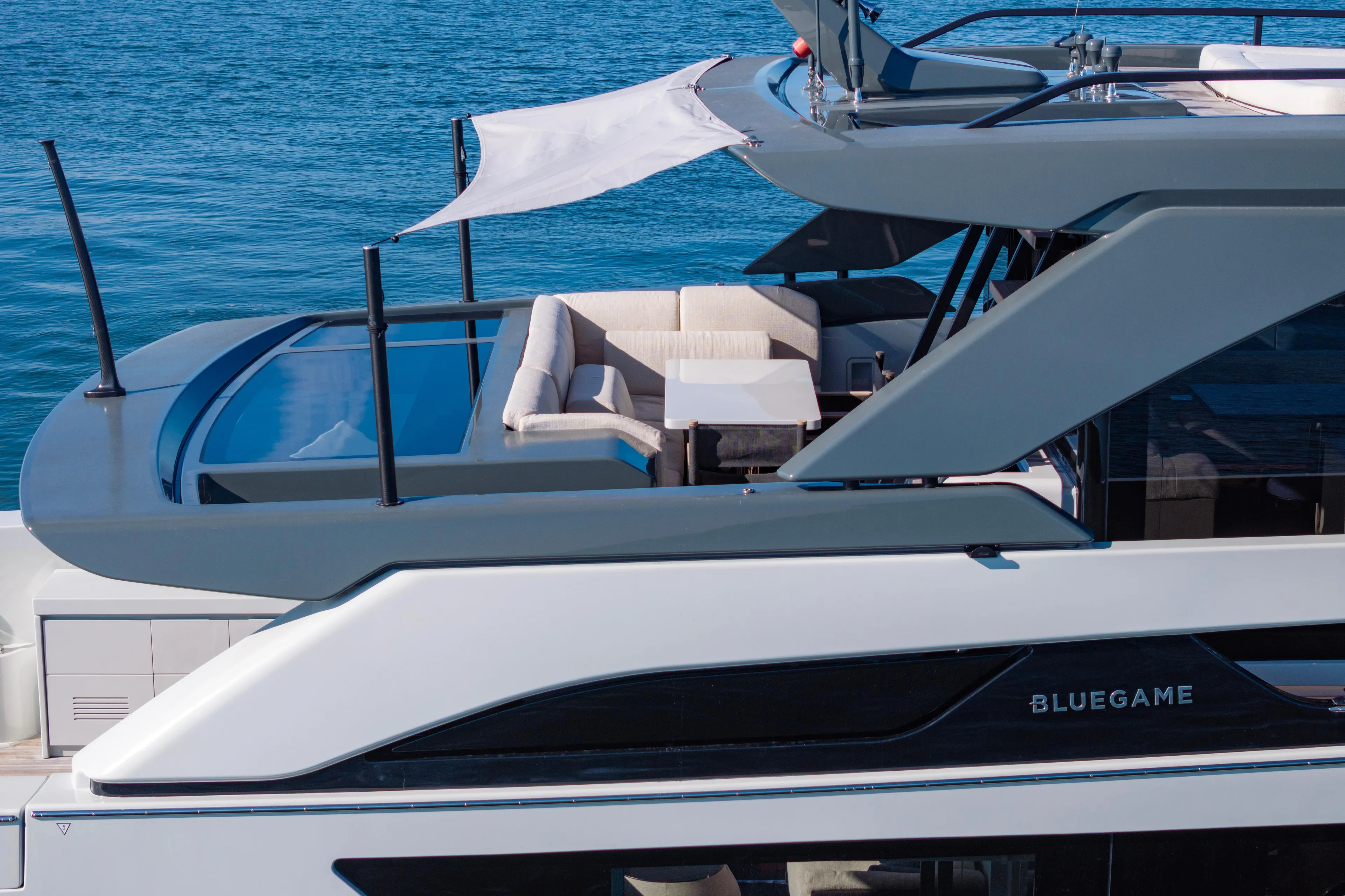 The Calm Down Yacht Photos Pics 2024 Bluegame BGX63 yacht with sleek design and luxurious seating area.
