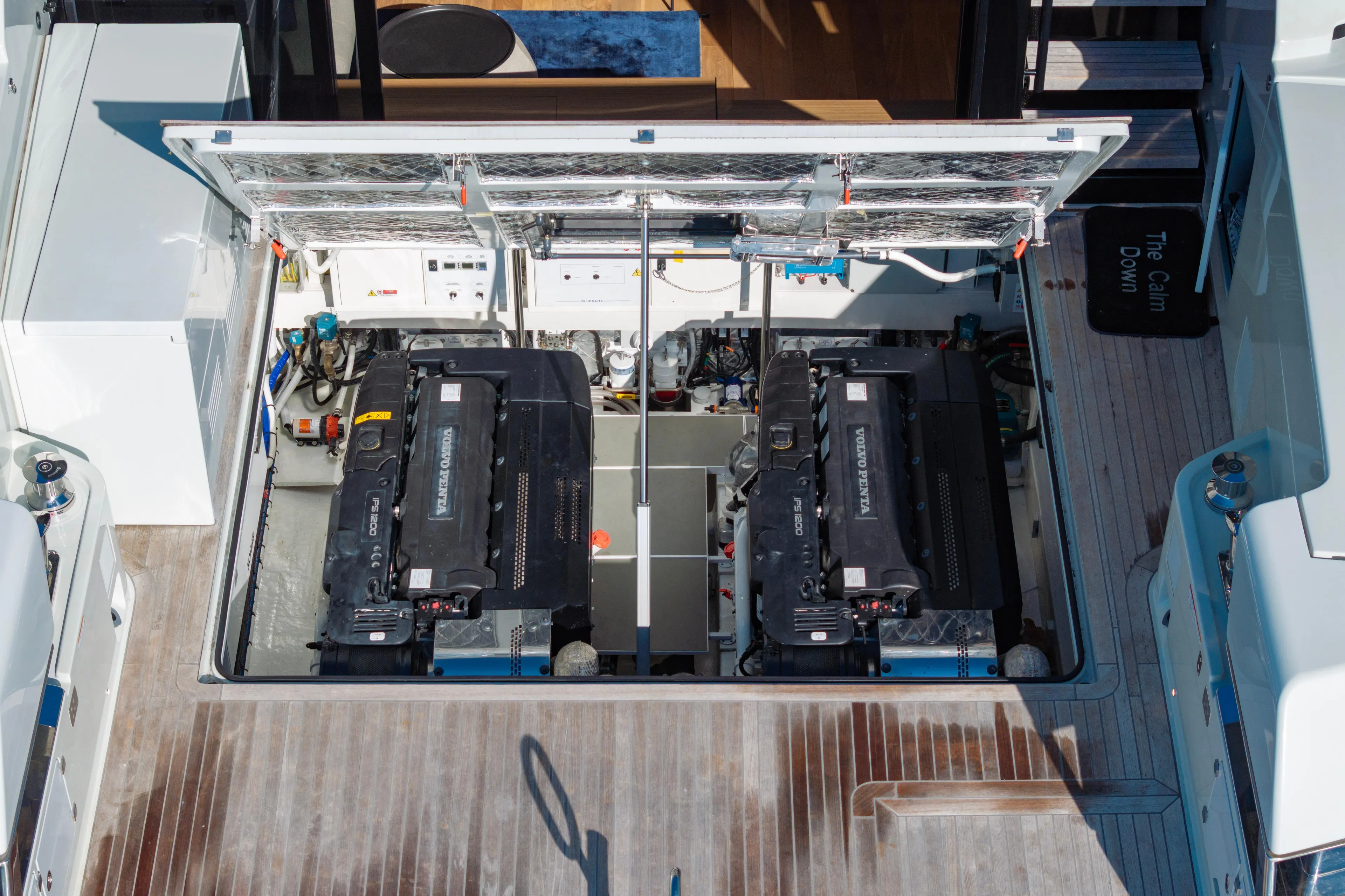 The Calm Down Yacht Photos Pics Engine compartment of 2024 Bluegame BGX63 yacht, featuring dual Volvo Penta engines.