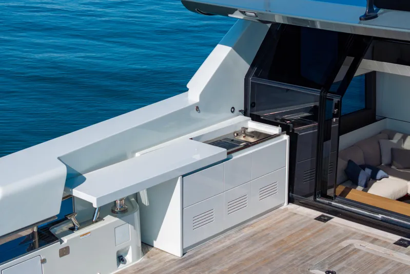 The Calm Down Yacht Photos Pics 2024 Bluegame BGX63 yacht deck with sleek outdoor kitchen and seating area.
