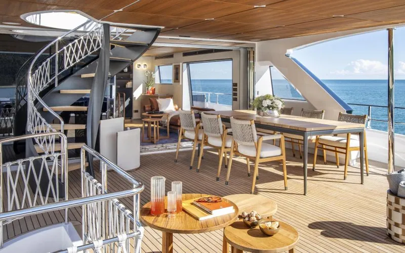  Yacht Photos Pics Luxurious 2024 Custom Line Navetta 30 yacht interior with elegant dining area and ocean view.