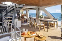 Luxurious 2024 Custom Line Navetta 30 yacht interior with elegant dining area and ocean view.