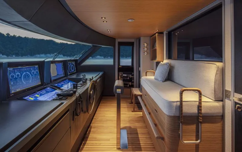  Yacht Photos Pics 2024 Custom Line Navetta 30 yacht interior with modern navigation equipment and luxurious seating.