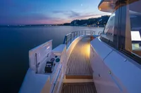 Luxurious 2024 Custom Line Navetta 30 yacht at sunset, featuring elegant deck and serene ocean view.