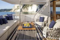 Luxurious 2024 Custom Line Navetta 30 yacht deck with elegant seating and ocean view.