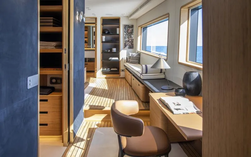  Yacht Photos Pics Luxurious interior of 2024 Custom Line Navetta 30 yacht with elegant wood finishes and ocean view.