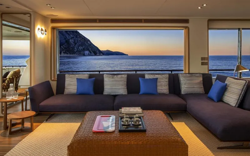  Yacht Photos Pics Luxurious 2024 Custom Line Navetta 30 yacht interior with ocean view at sunset.