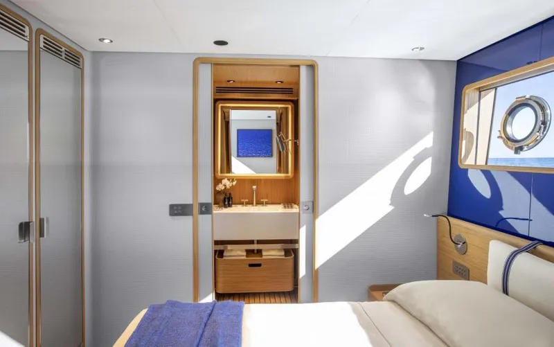  Yacht Photos Pics Luxurious 2024 Custom Line Navetta 30 yacht bedroom with modern design and ocean view.
