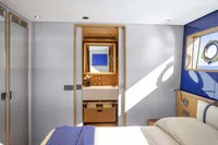 Luxurious 2024 Custom Line Navetta 30 yacht bedroom with modern design and ocean view.