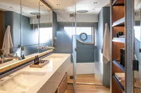 Luxurious bathroom in 2024 Custom Line Navetta 30 yacht with modern fixtures and ocean view.