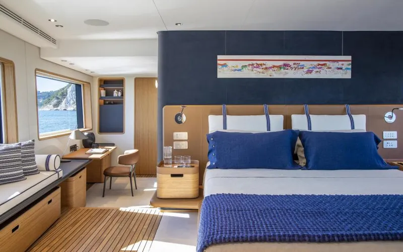  Yacht Photos Pics Luxurious 2024 Custom Line Navetta 30 yacht interior with elegant bedroom and scenic ocean view.