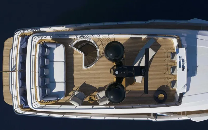  Yacht Photos Pics Aerial view of 2024 Custom Line Navetta 30 yacht deck, featuring luxurious seating and modern design.