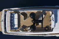 Aerial view of 2024 Custom Line Navetta 30 yacht deck, featuring luxurious seating and modern design.