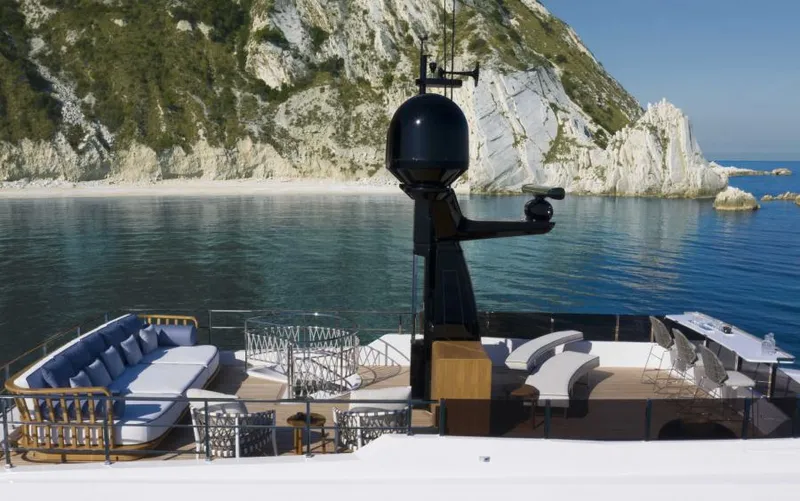  Yacht Photos Pics Luxurious 2024 Custom Line Navetta 30 yacht with elegant deck, scenic coastal backdrop.