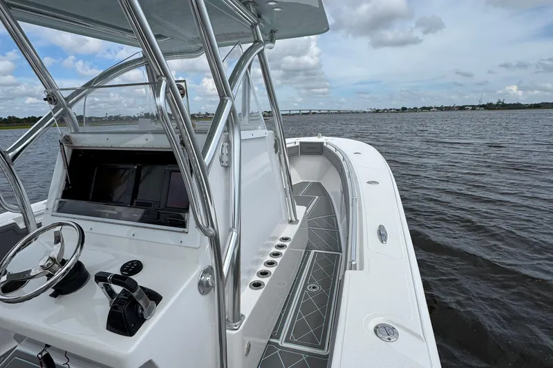  Yacht Photos Pics 2013 SeaHunter 33 Tournament boat on water, featuring sleek design and modern controls.