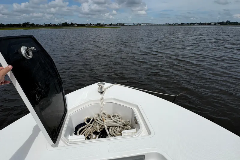  Yacht Photos Pics 2013 SeaHunter 33 Tournament boat with open anchor hatch on calm water.