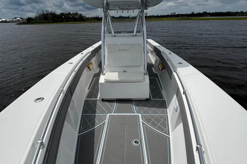  Yacht Photos Pics 2013 SeaHunter 33 Tournament boat on water, featuring spacious deck and sleek design.