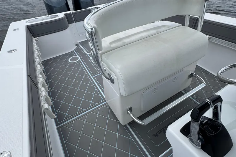  Yacht Photos Pics 2013 SeaHunter 33 Tournament boat interior with cushioned seating and sleek flooring design.
