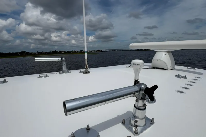  Yacht Photos Pics 2013 SeaHunter 33 Tournament boat deck with Garmin equipment under cloudy sky.