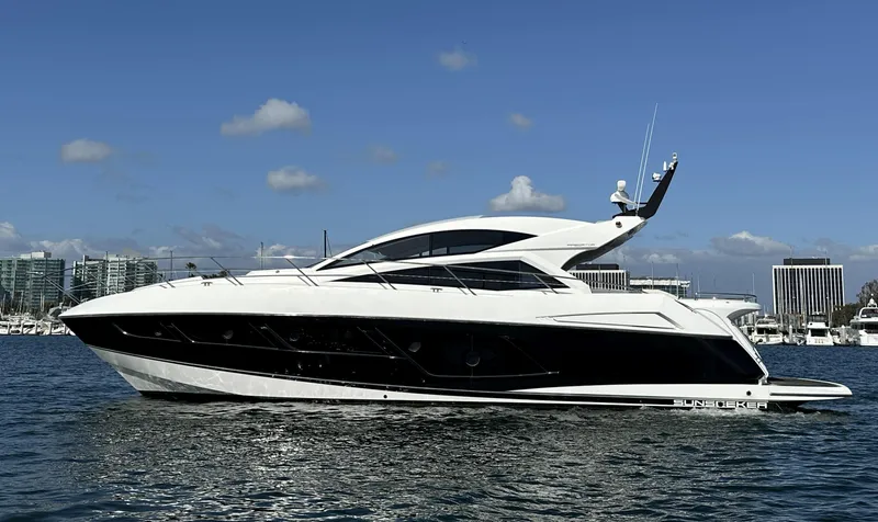 Tucker II Yacht Photos Pics 2015 Sunseeker Predator 57 yacht on water, sleek design, clear sky background.