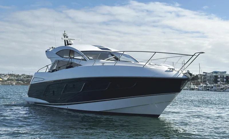 Tucker II Yacht Photos Pics 2015 Sunseeker Predator 57 yacht on water, showcasing sleek design and luxury features.