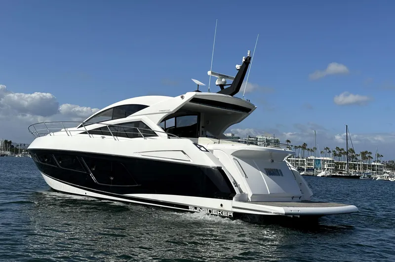 Tucker II Yacht Photos Pics 2015 Sunseeker Predator 57 yacht on water, clear sky background.