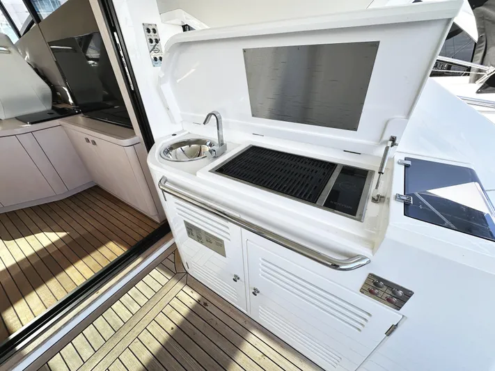 Tucker II Yacht Photos Pics Outdoor kitchen on 2015 Sunseeker Predator 57 yacht with sink and grill.