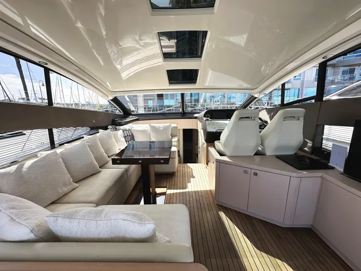 Tucker II Yacht Photos Pics Luxurious interior of 2015 Sunseeker Predator 57 yacht with plush seating and modern design.