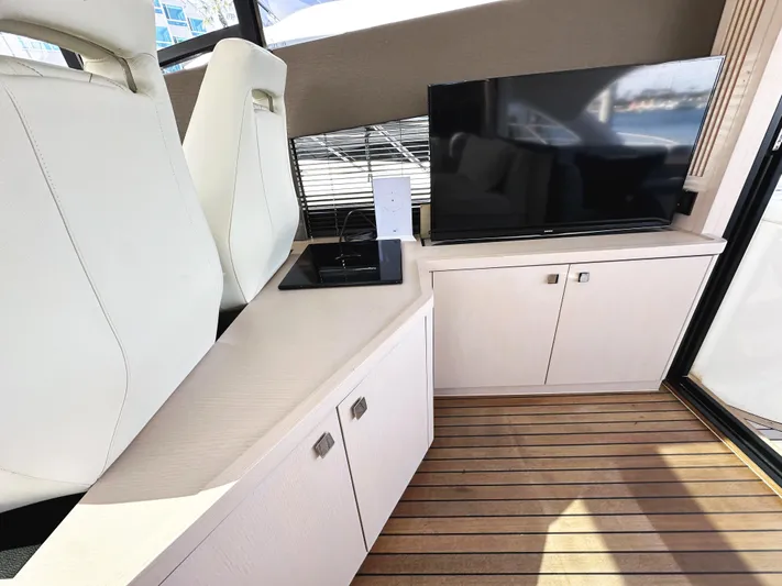 Tucker II Yacht Photos Pics Interior of 2015 Sunseeker Predator 57 yacht with modern seating and entertainment area.