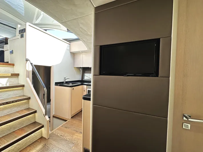 Tucker II Yacht Photos Pics Interior of 2015 Sunseeker Predator 57 yacht with modern kitchen and staircase.
