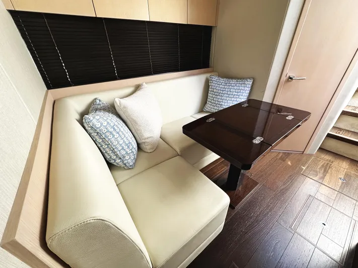 Tucker II Yacht Photos Pics Luxurious interior of 2015 Sunseeker Predator 57 yacht with elegant seating and table.