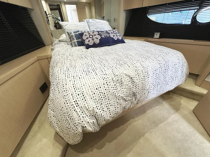 Tucker II Yacht Photos Pics Luxurious bedroom interior of 2015 Sunseeker Predator 57 yacht with elegant bedding.