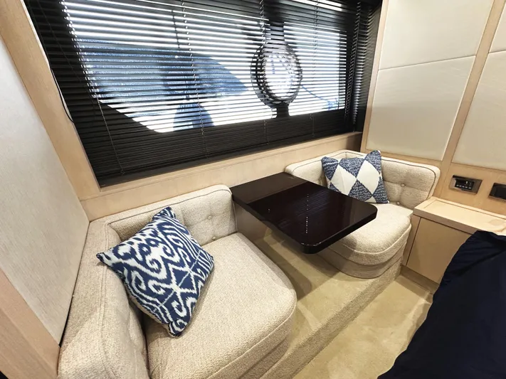 Tucker II Yacht Photos Pics Luxurious interior of 2015 Sunseeker Predator 57 yacht with cozy seating and decorative pillows.
