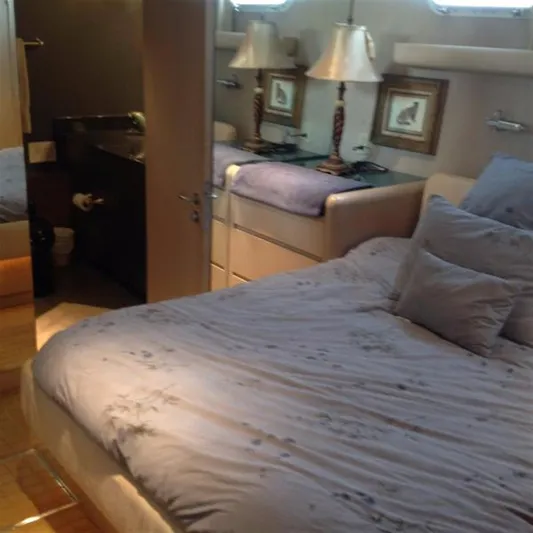 Audacity Yacht Photos Pics Luxurious bedroom interior on 1990 Broward Raised Pilothouse MY yacht.
