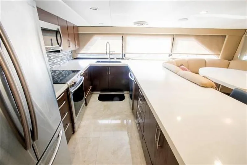 Audacity Yacht Photos Pics Luxurious kitchen in 1990 Broward Raised Pilothouse MY yacht with modern appliances.