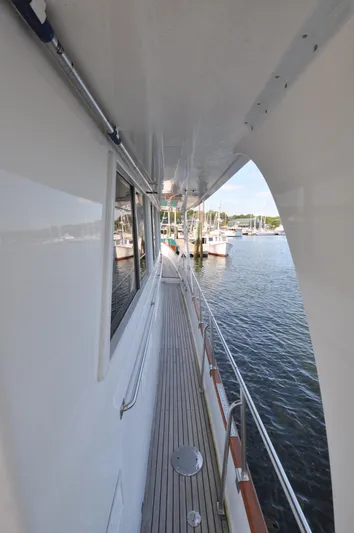  Yacht Photos Pics Side deck view of 2000 Grand Banks Heritage Europa 52 yacht in marina.