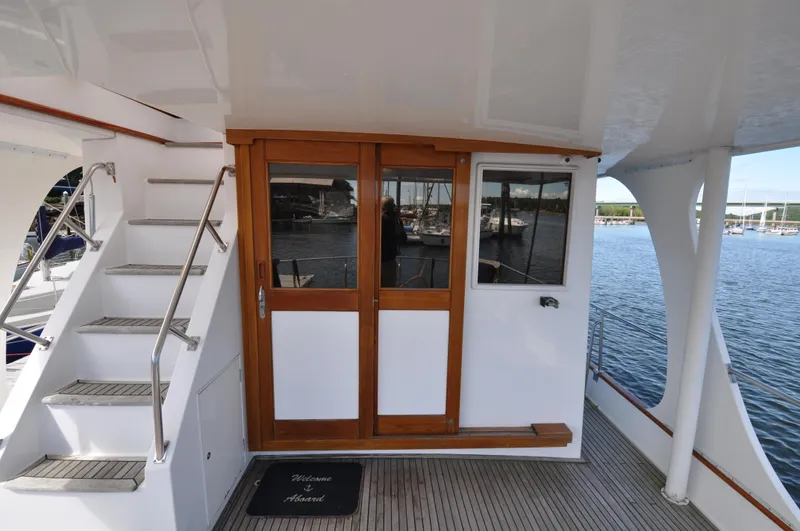  Yacht Photos Pics Grand Banks Heritage Europa 52 yacht deck with wooden doors and staircase, 2000 model.