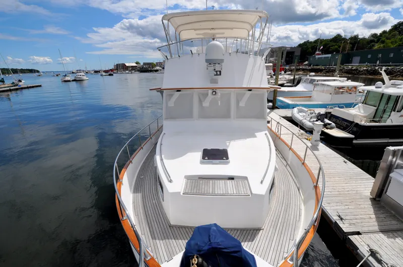  Yacht Photos Pics Grand Banks Heritage Europa 52 yacht docked at a marina, 2000 model, with clear skies.