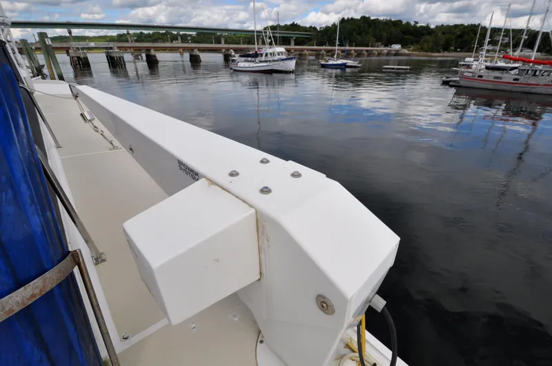  Yacht Photos Pics Grand Banks Heritage Europa 52 yacht docked near a calm marina, 2000 model.