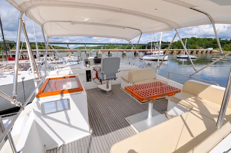  Yacht Photos Pics Flybridge of 2000 Grand Banks Heritage Europa 52 yacht with seating and helm station.