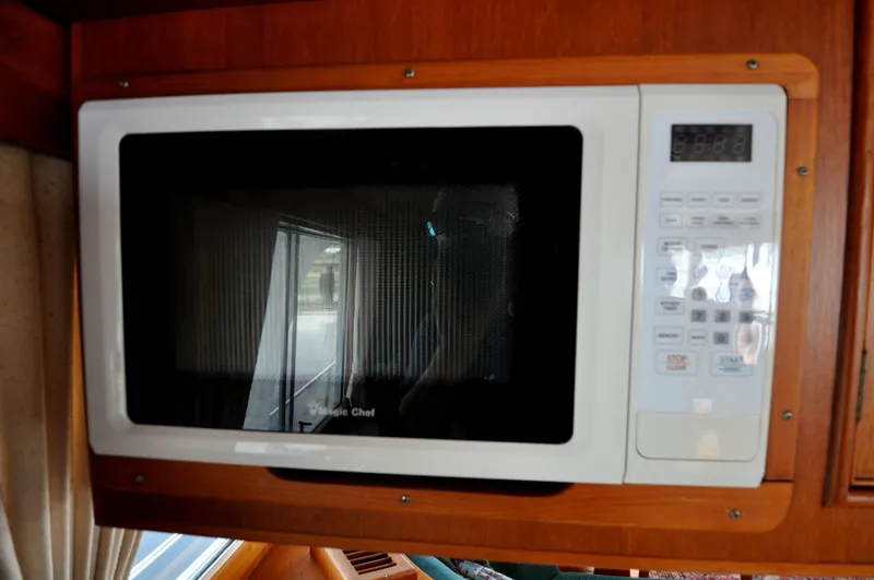  Yacht Photos Pics Microwave oven inside a 2000 Grand Banks Heritage Europa 52 yacht kitchen.