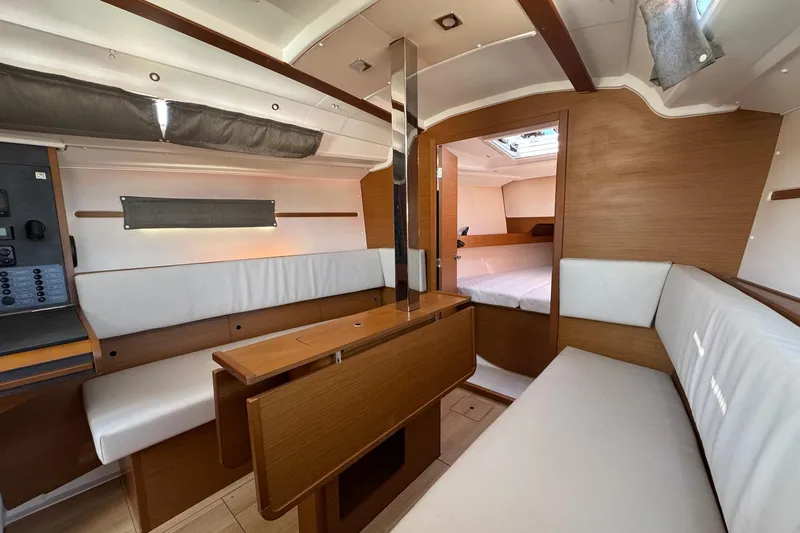  Yacht Photos Pics Interior of 2020 Jeanneau Sun Odyssey 349 sailboat, featuring cozy seating and modern design.