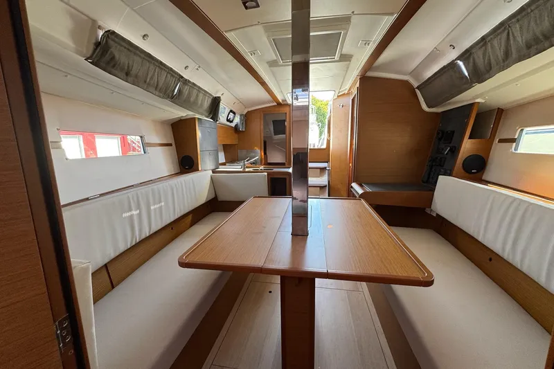  Yacht Photos Pics Interior of 2020 Jeanneau Sun Odyssey 349 sailboat, featuring a spacious dining area.