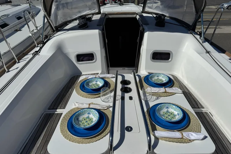  Yacht Photos Pics Elegant dining setup on Jeanneau Sun Odyssey 349 yacht, 2020 model.